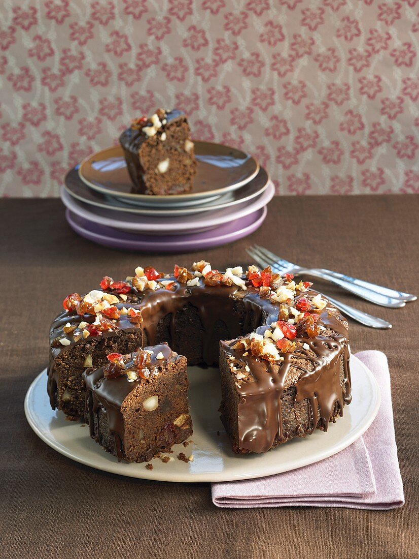 Ring-shaped whisky chocolate cake with macadamia nuts