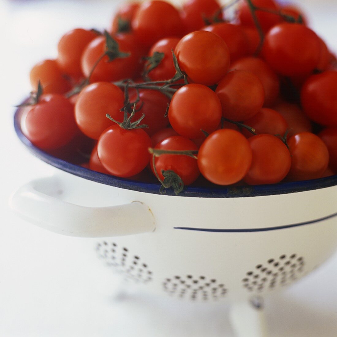 Cocktail tomatoes in a colander