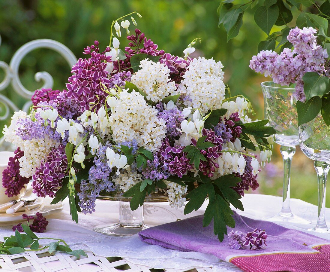 Arrangement of lilac and white bleeding heart