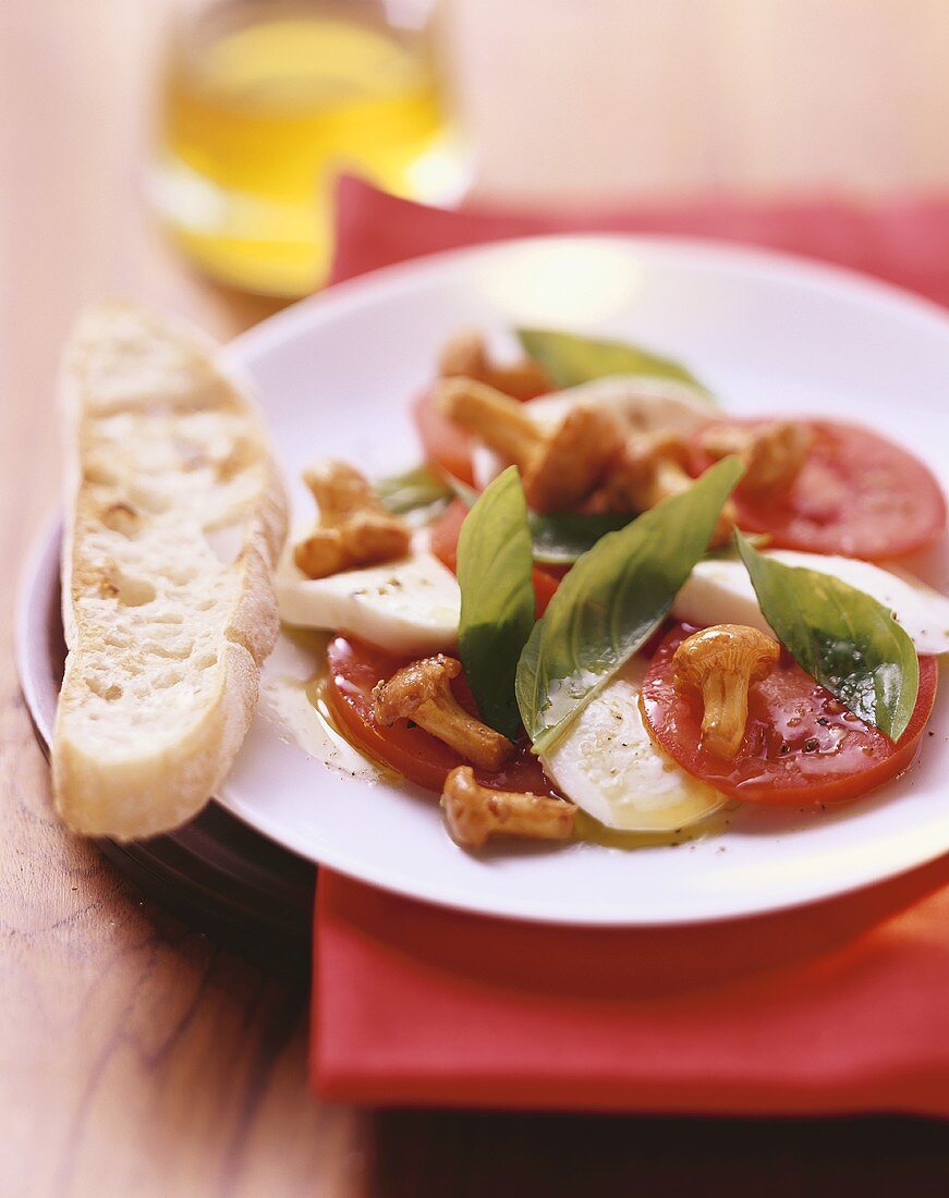 Tomato and mozzarella salad with fried chanterelles