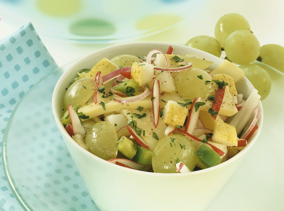 Cheese salad with grapes and pear