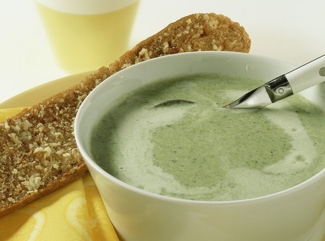 Broccoli and cheese soup with garlic baguette