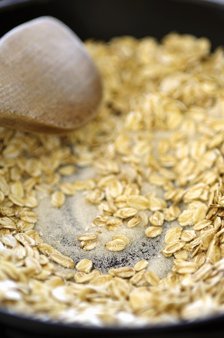 Toasting rolled oats with sugar (for Cranachan, Scotland)