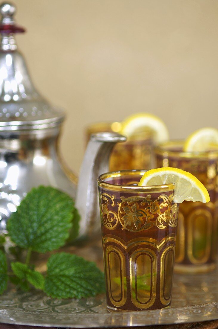 Green tea with mint in decorative glasses