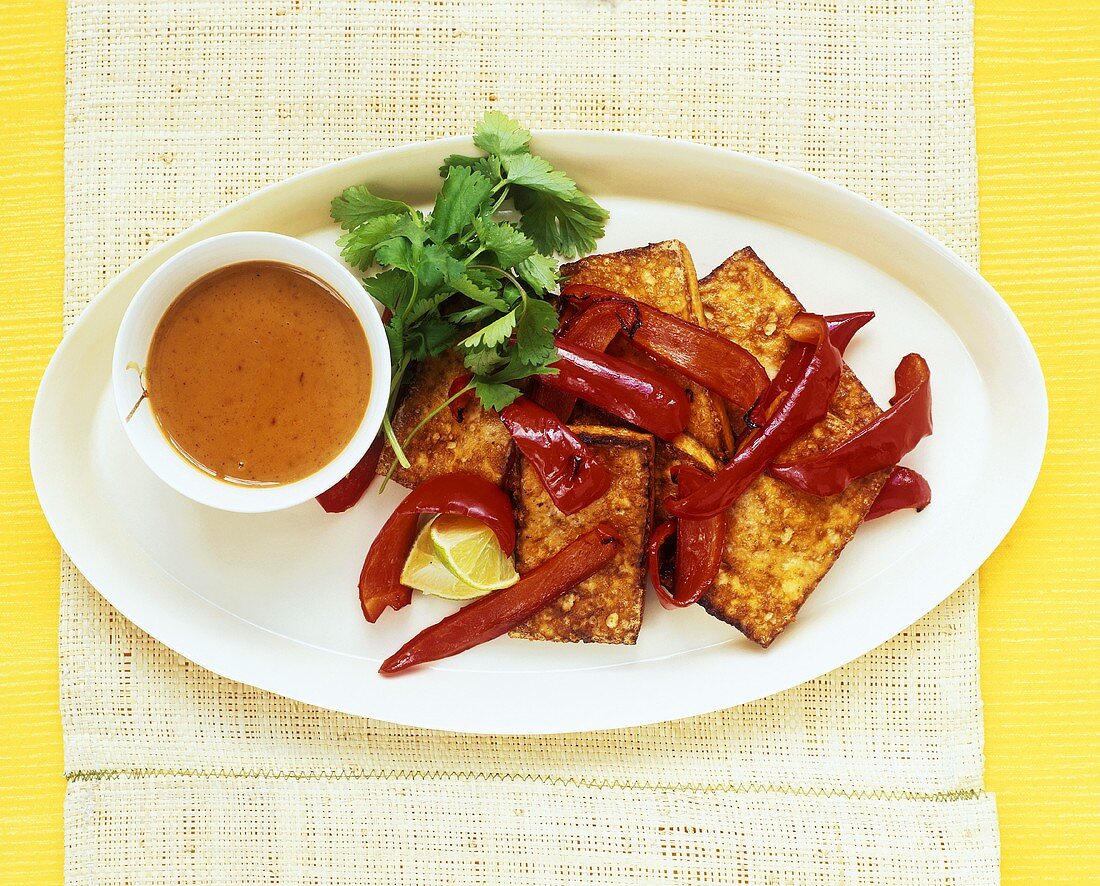 Fried tofu slices with strips of pepper