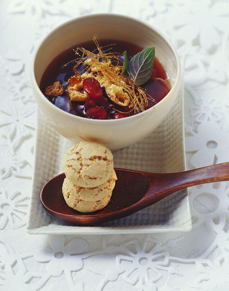 Cranberry soup with caramel strands and amarettini