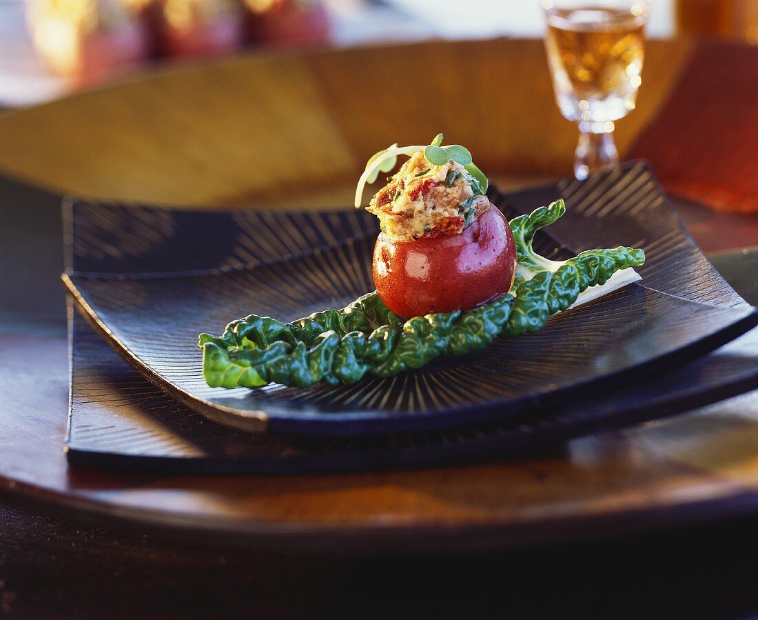 Potato with ham and cheese filling on chard leaf