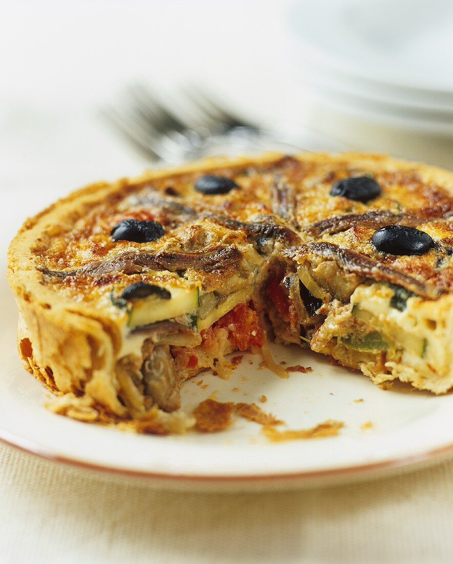 Courgette quiche with anchovies