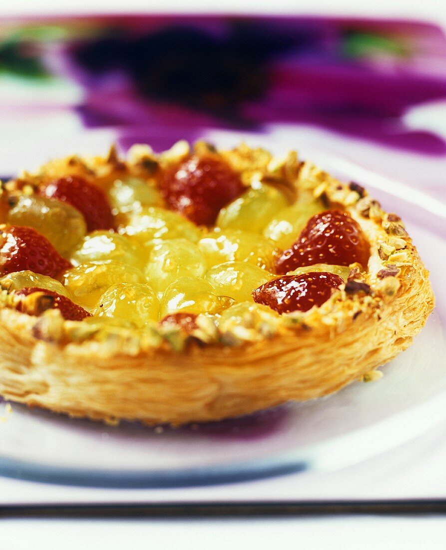 Puff pastry tart filled with strawberries and grapes