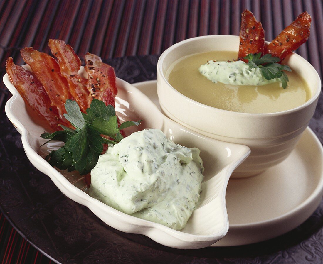 Creamed potato soup with celery cream and bacon