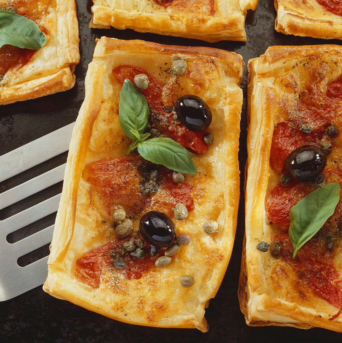 Puff pastry pizza with capers and olives