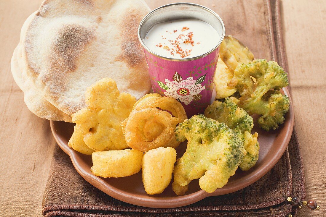 Vegetable tempura with yoghurt dip and Indian flatbread