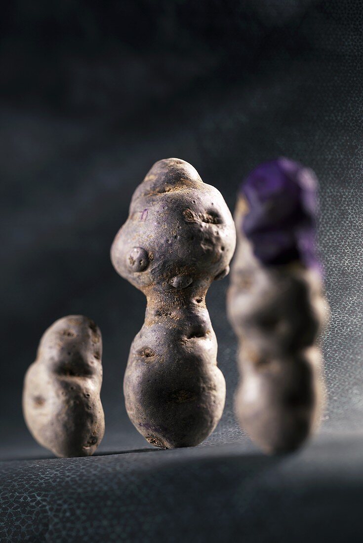 Three purple potatoes