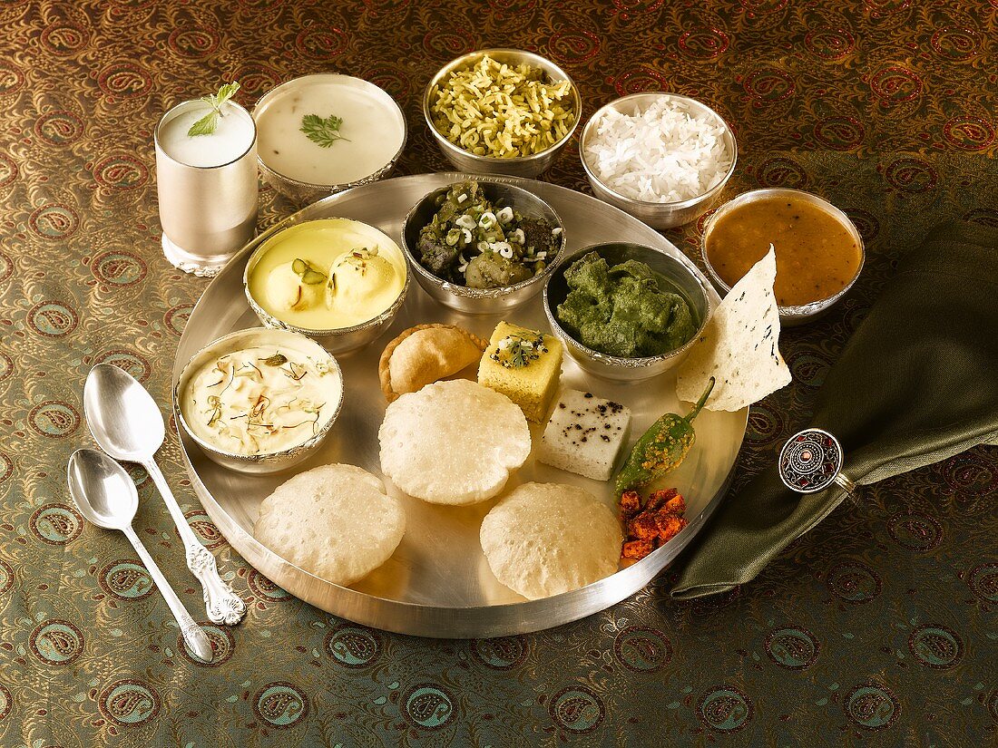 Thali (an assortment of dishes and dips), Gujarat, India