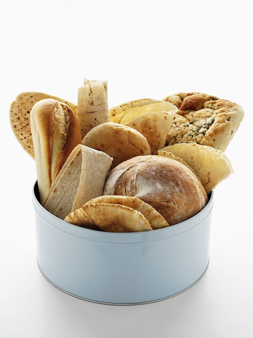 Assorted bread products in pale blue tin