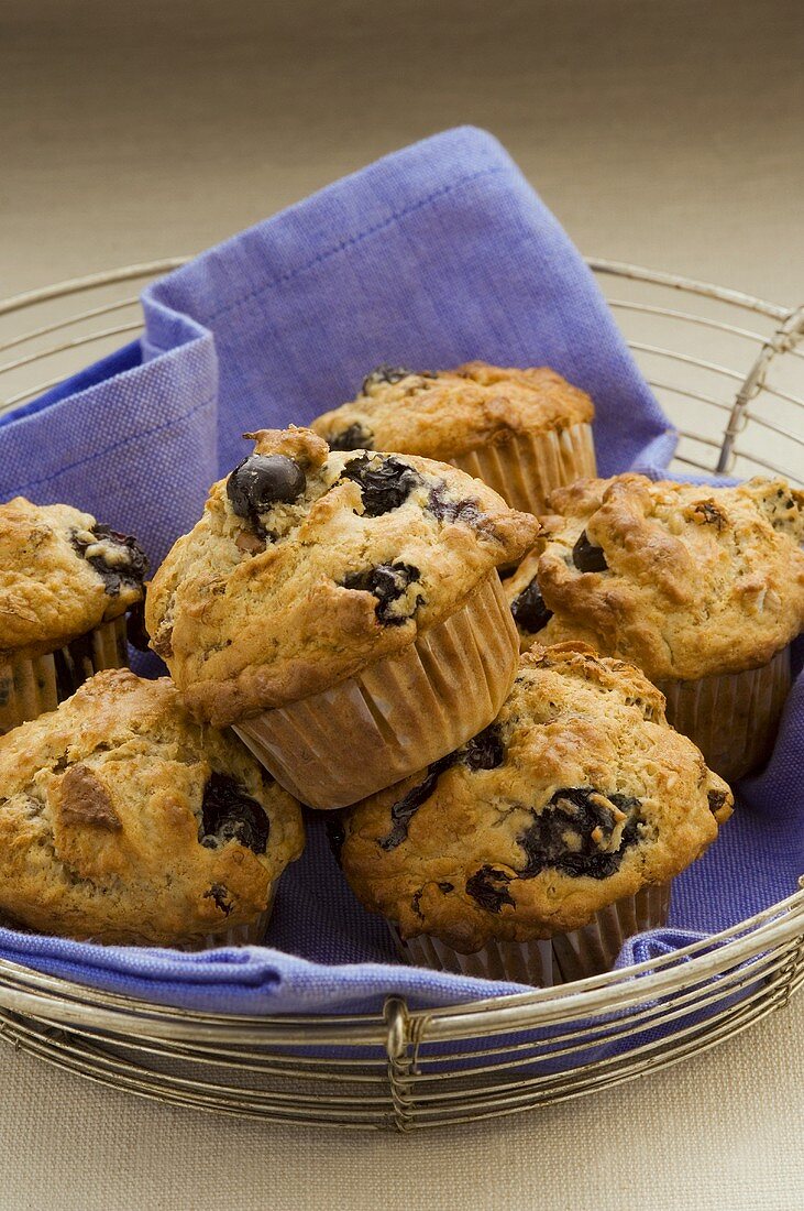 Several blueberry muffins in a wire basket