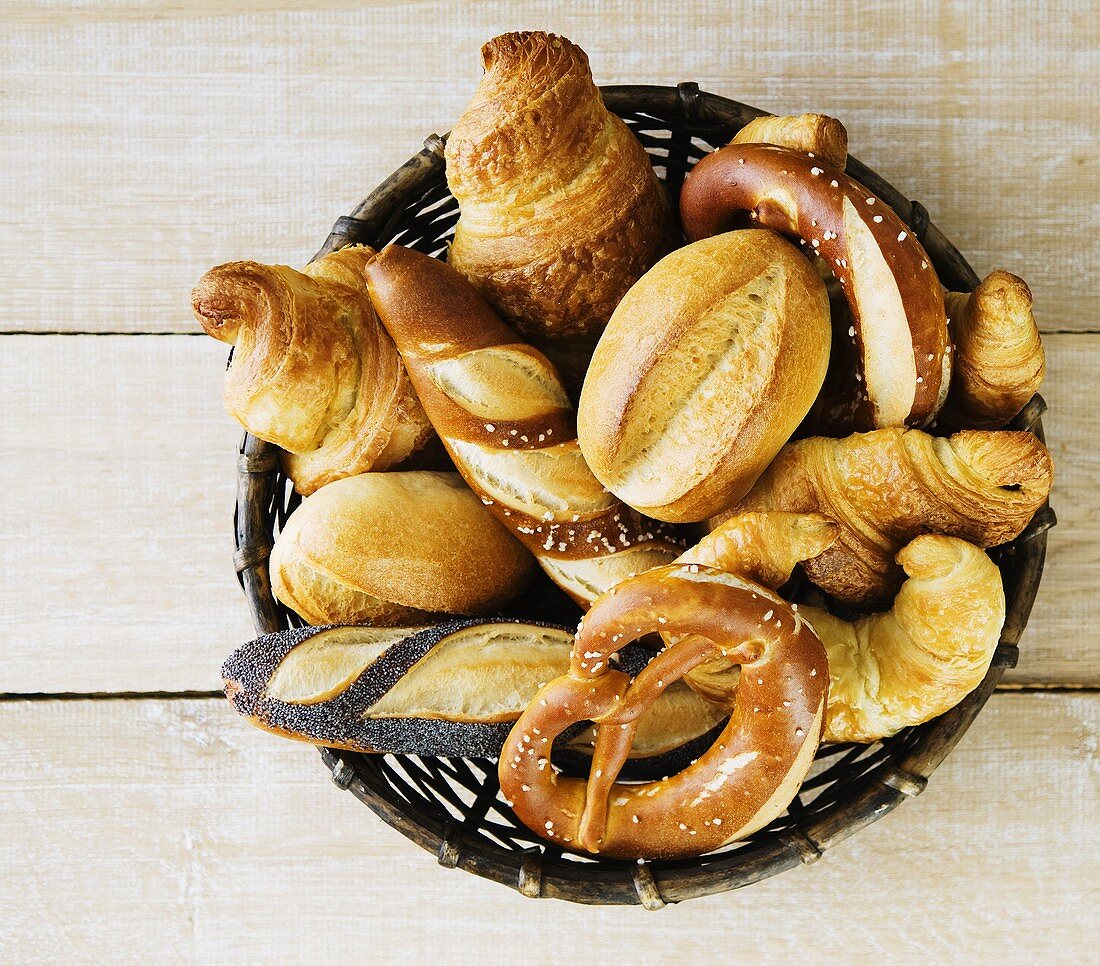 Pretzel rolls, bread rolls and croissants in bread basket