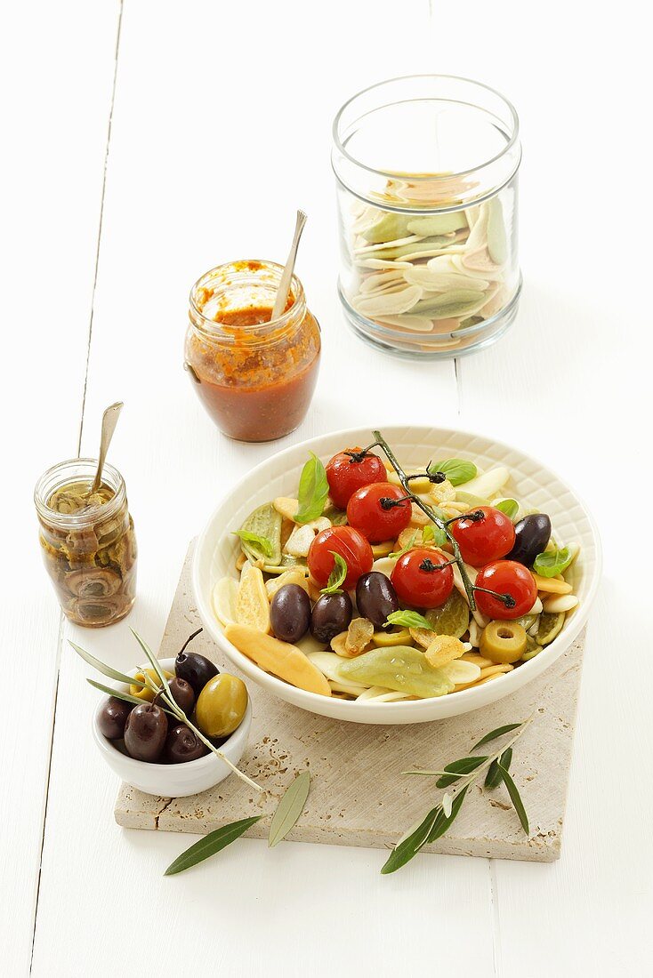 Pasta with cherry tomatoes, olives and anchovies