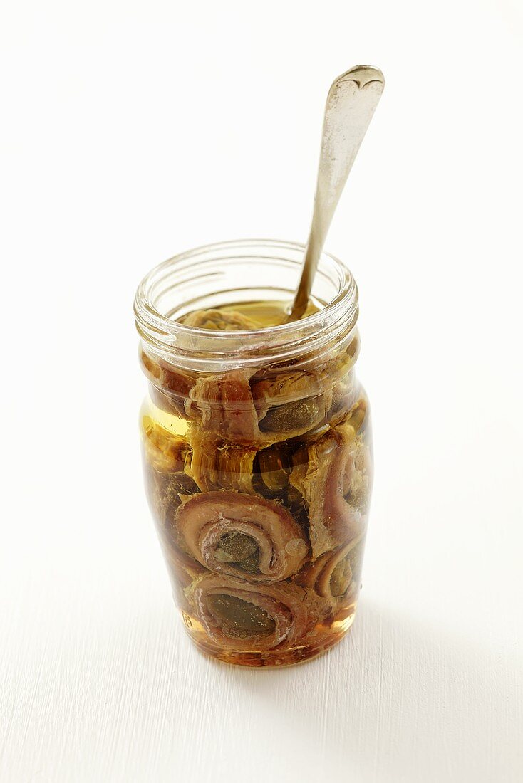 Anchovies with capers in a jar