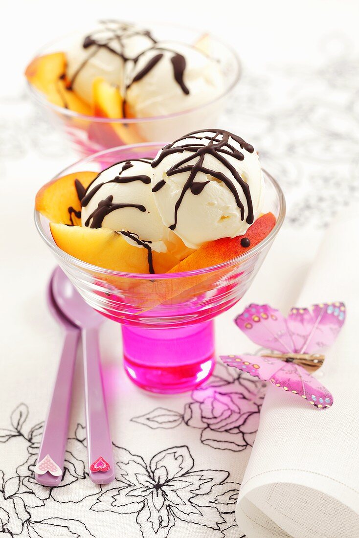 Vanilla ice cream with chocolate sauce and nectarines
