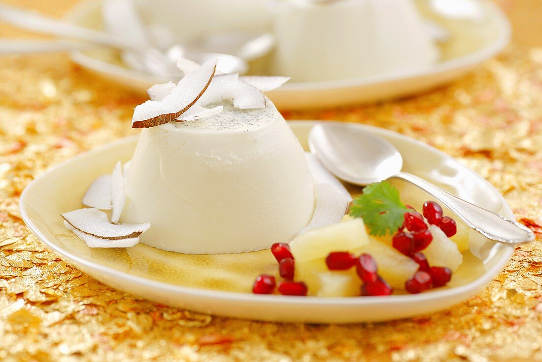 Panna cotta with coconut, pineapple and pomegranate seeds