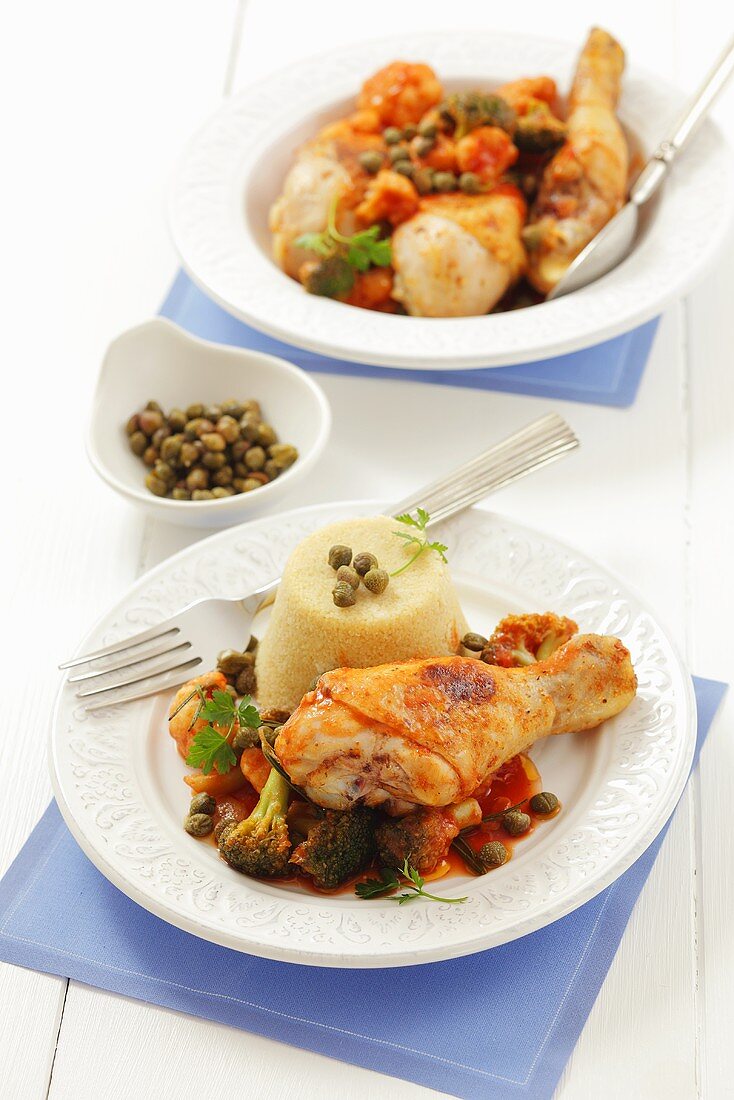 Chicken drumstick with broccoli, tomato sauce and couscous