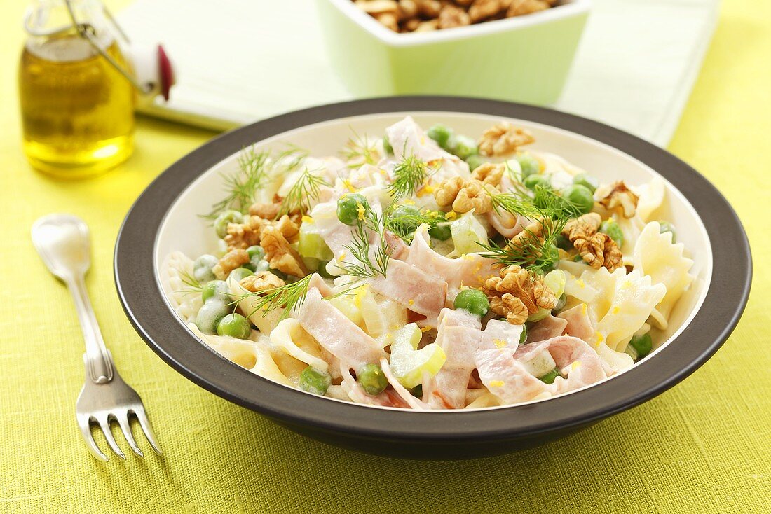 Farfalle with ham, walnuts, peas, celery and dill