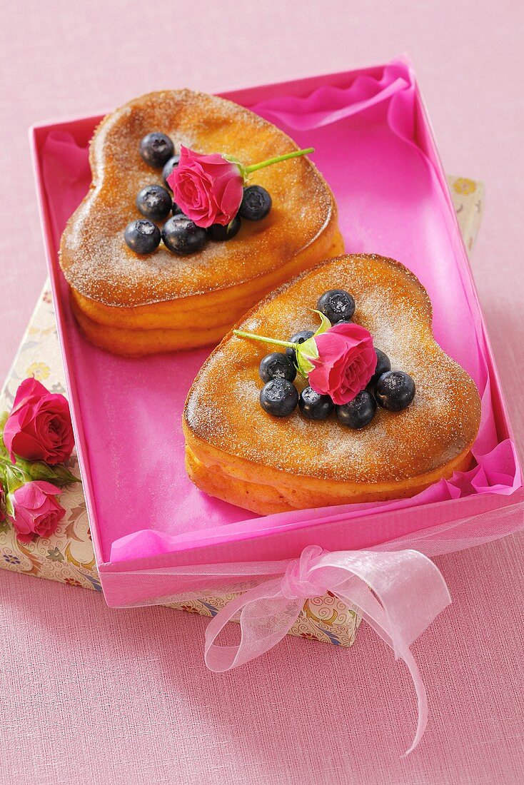 Heart-shaped cheesecakes with blueberries