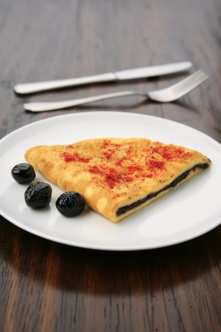Omelette filled with olive paste