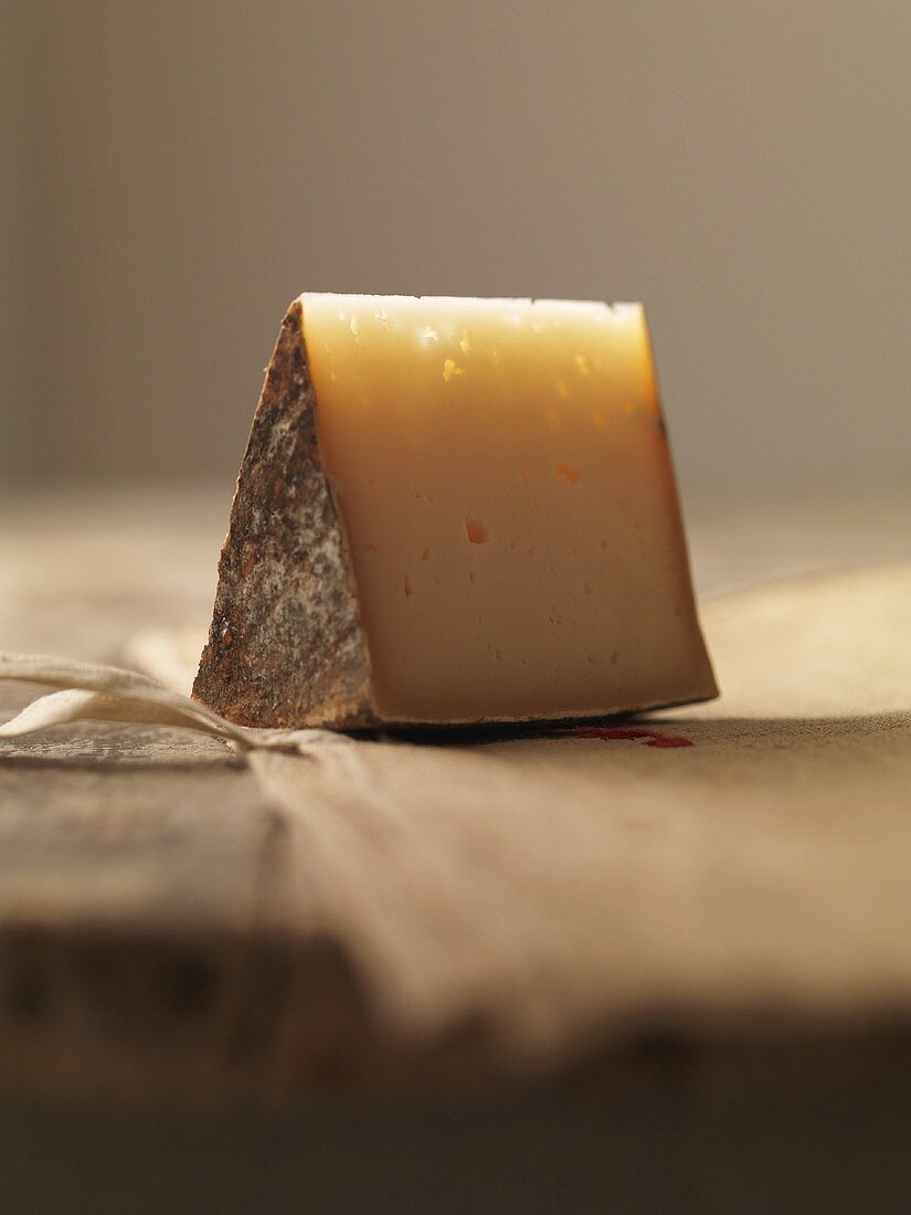 Piece of Basque cheese on linen cloth