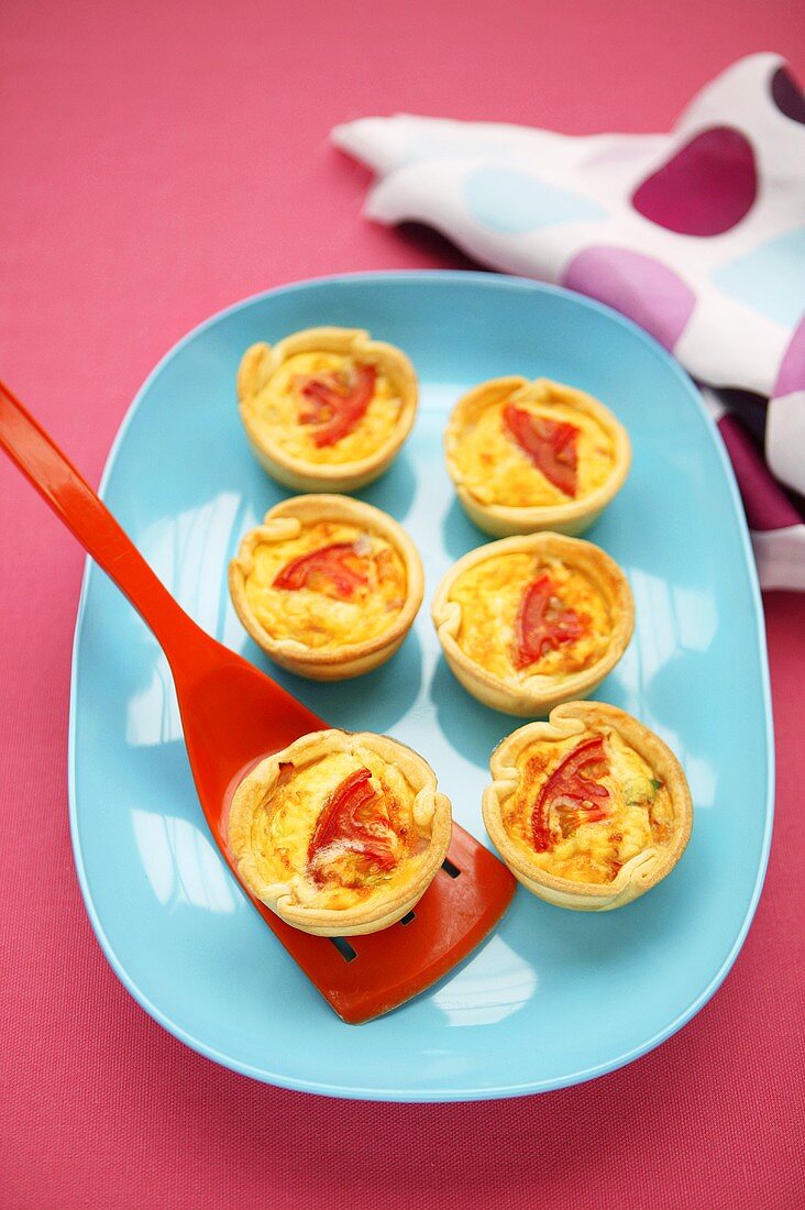 Small cheese and tomato quiches