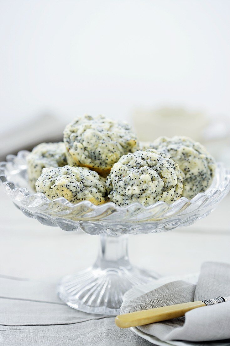 Lemon and poppy seed muffins on cake stand