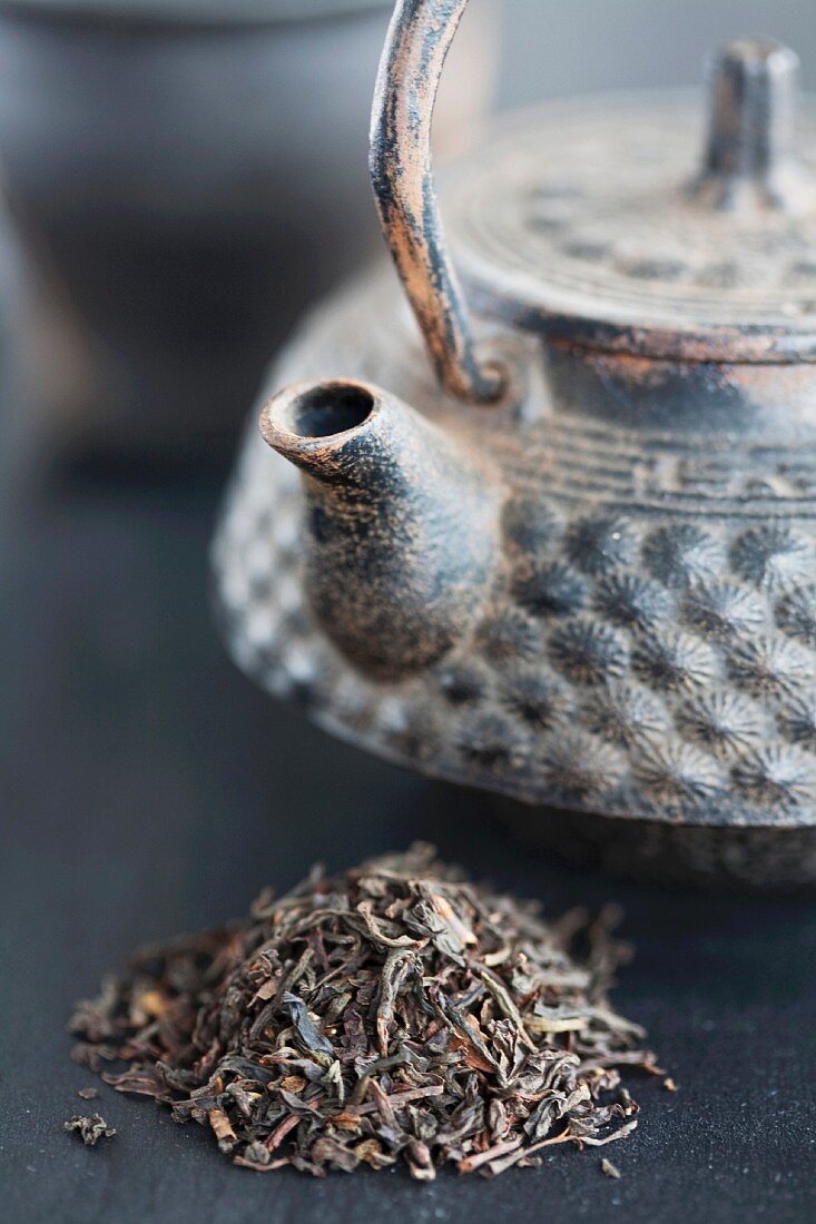 Asian teapot and black tea