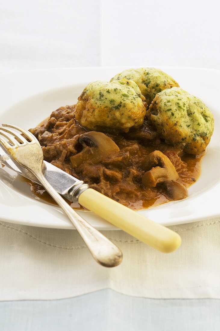 Meat and mushroom ragout with bread dumplings