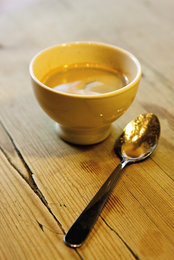 Cup of espresso with spoon