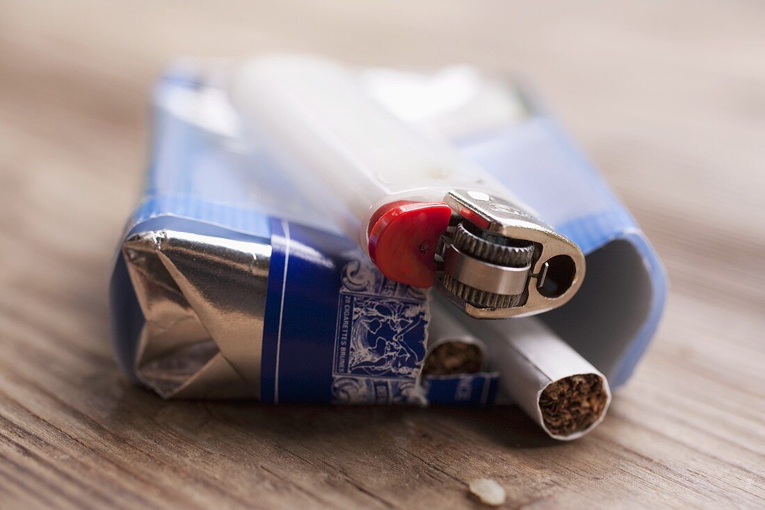 Packet of cigarettes and cigarette lighter