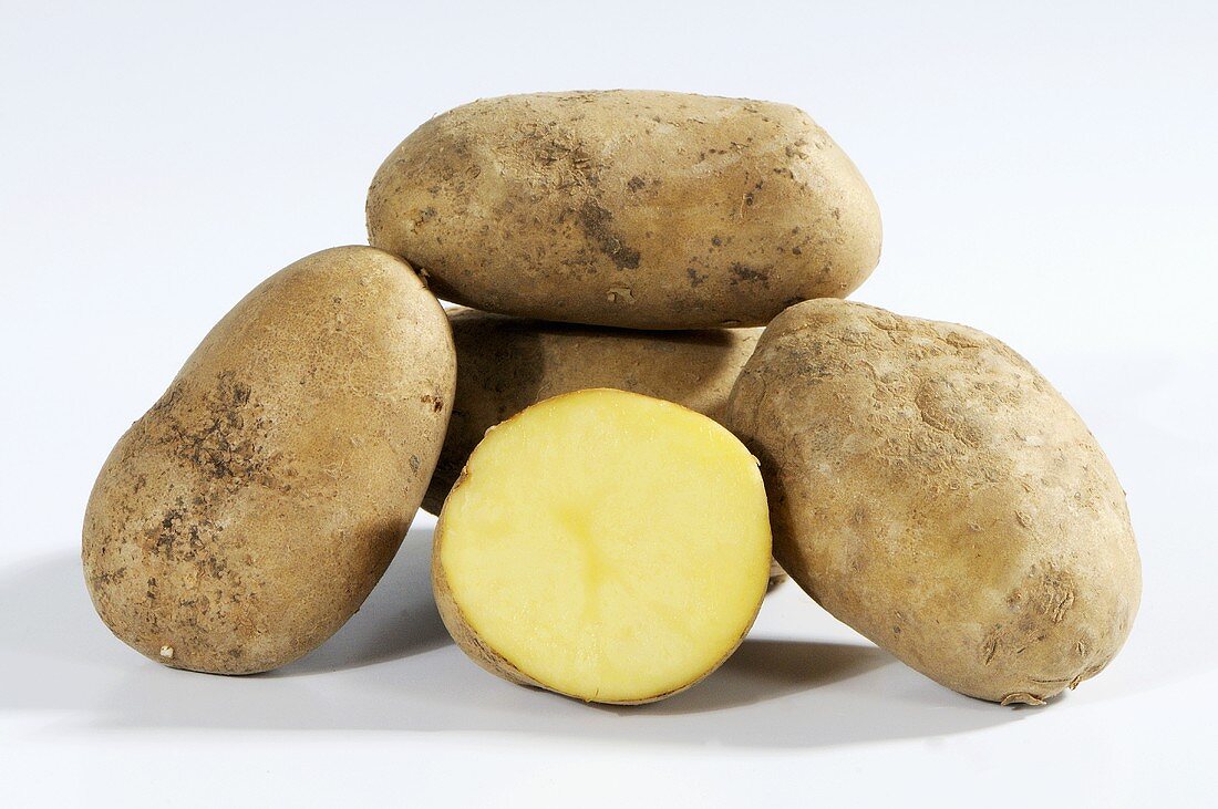 Several potatoes (variety 'Heideniere'), whole and one half