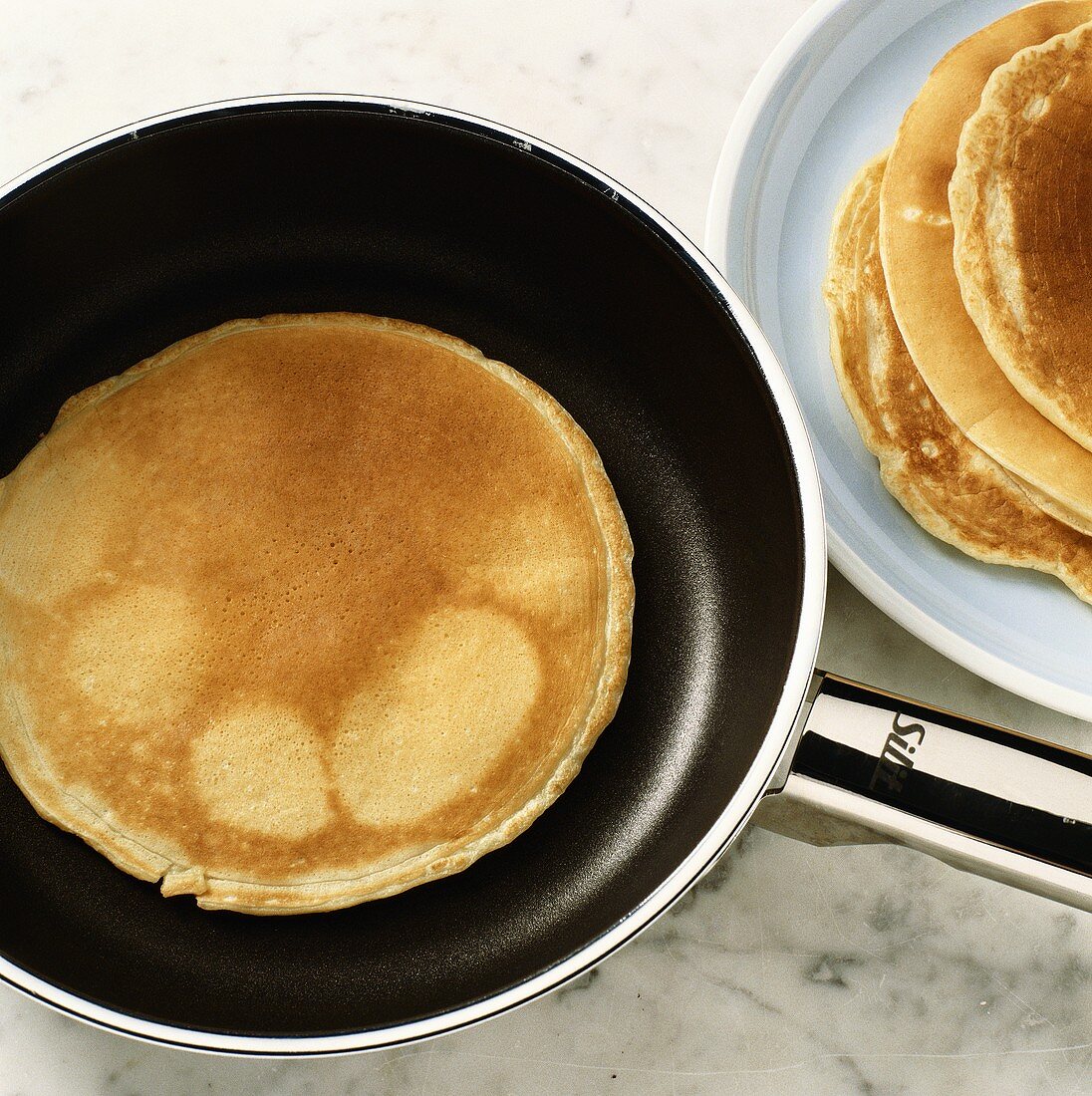 Frying a pancake in frying pan