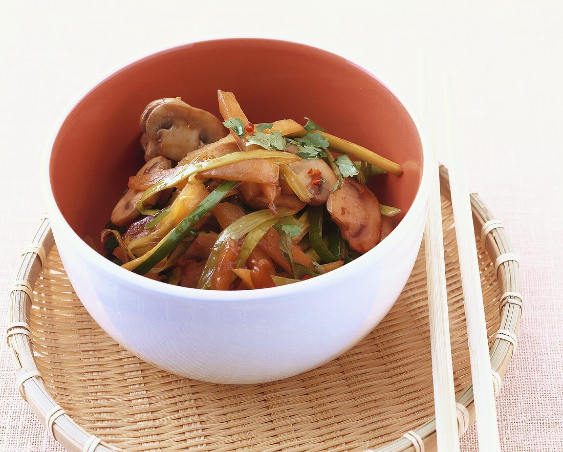 Pumpkin, mushrooms and leeks cooked in the wok