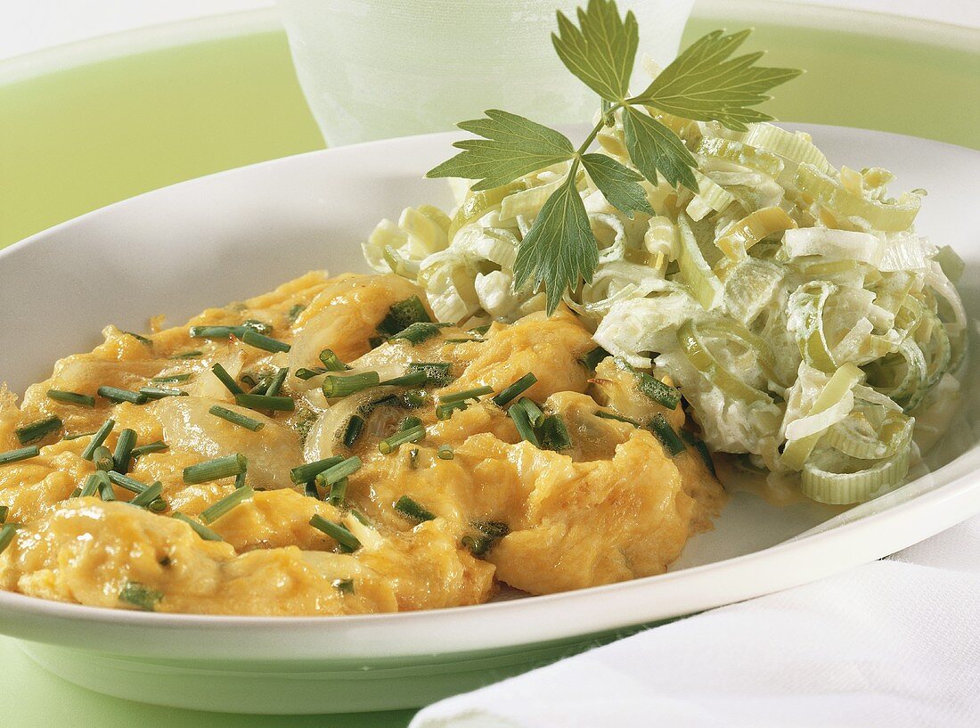 Scrambled eggs and cheese with leeks