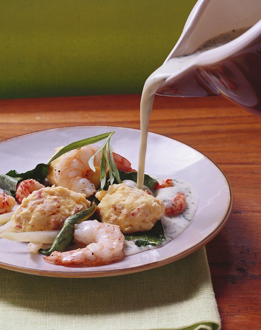 Shellfish dumplings with tarragon sauce and chard