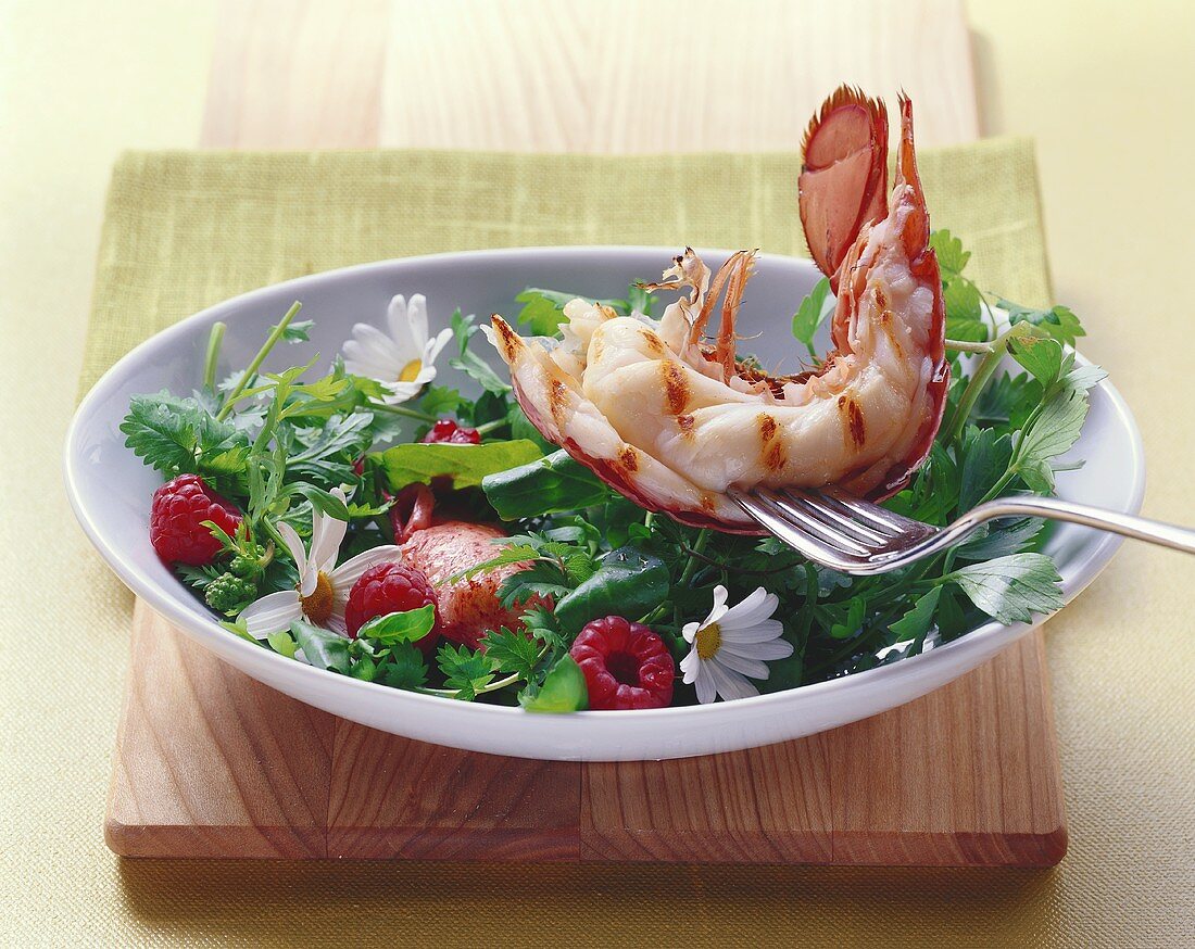 Half grilled lobster with wild herb salad