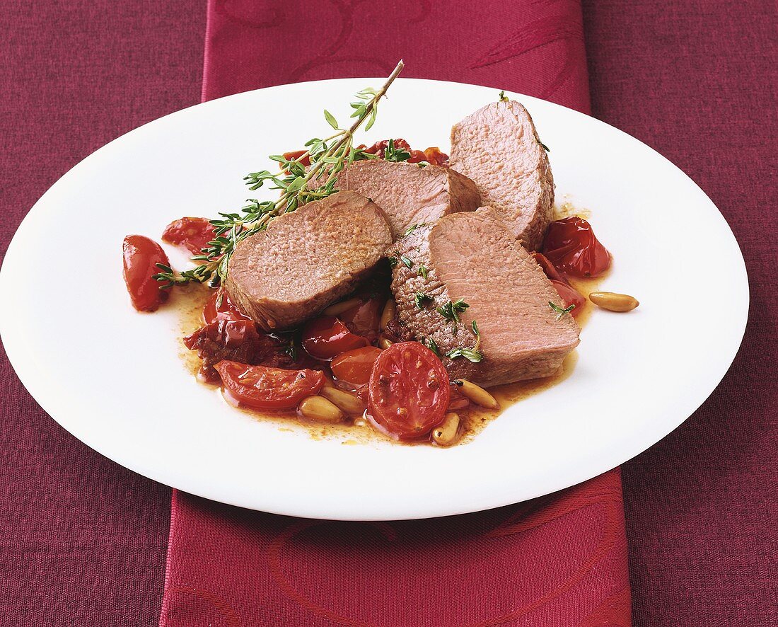 Saddle of lamb with cherry tomatoes