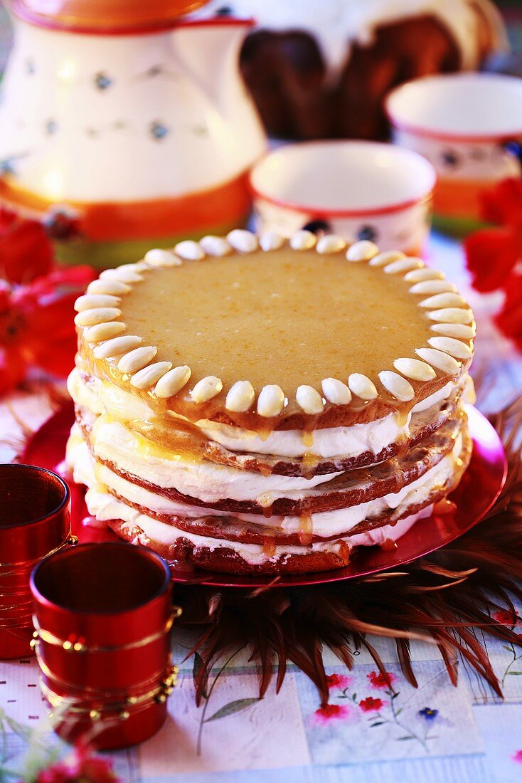 Layer cake with peach jam and whipped cream filling for Easter