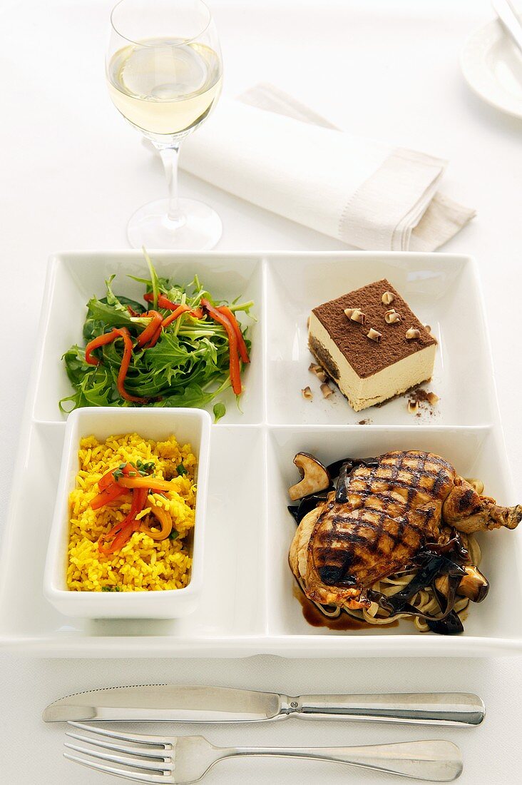 Meal: chicken, rice, salad and tiramisu