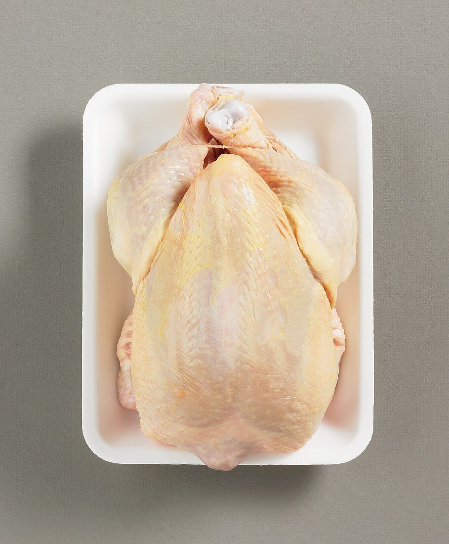 Whole chicken on plastic tray