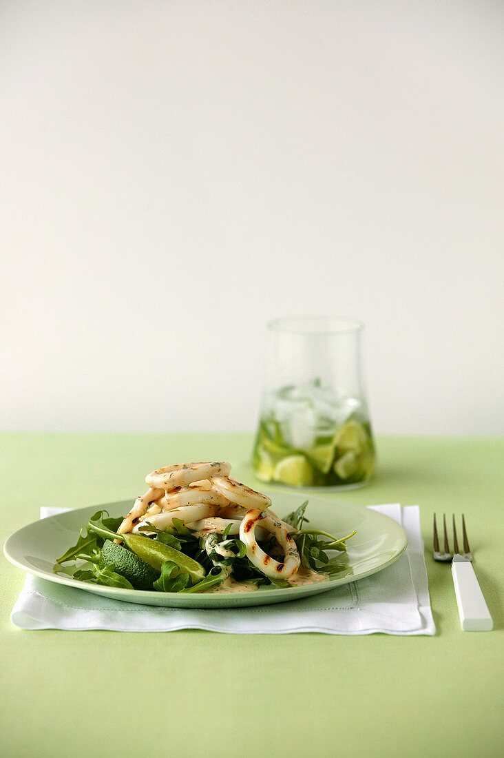 Grilled squid salad with rocket and lime