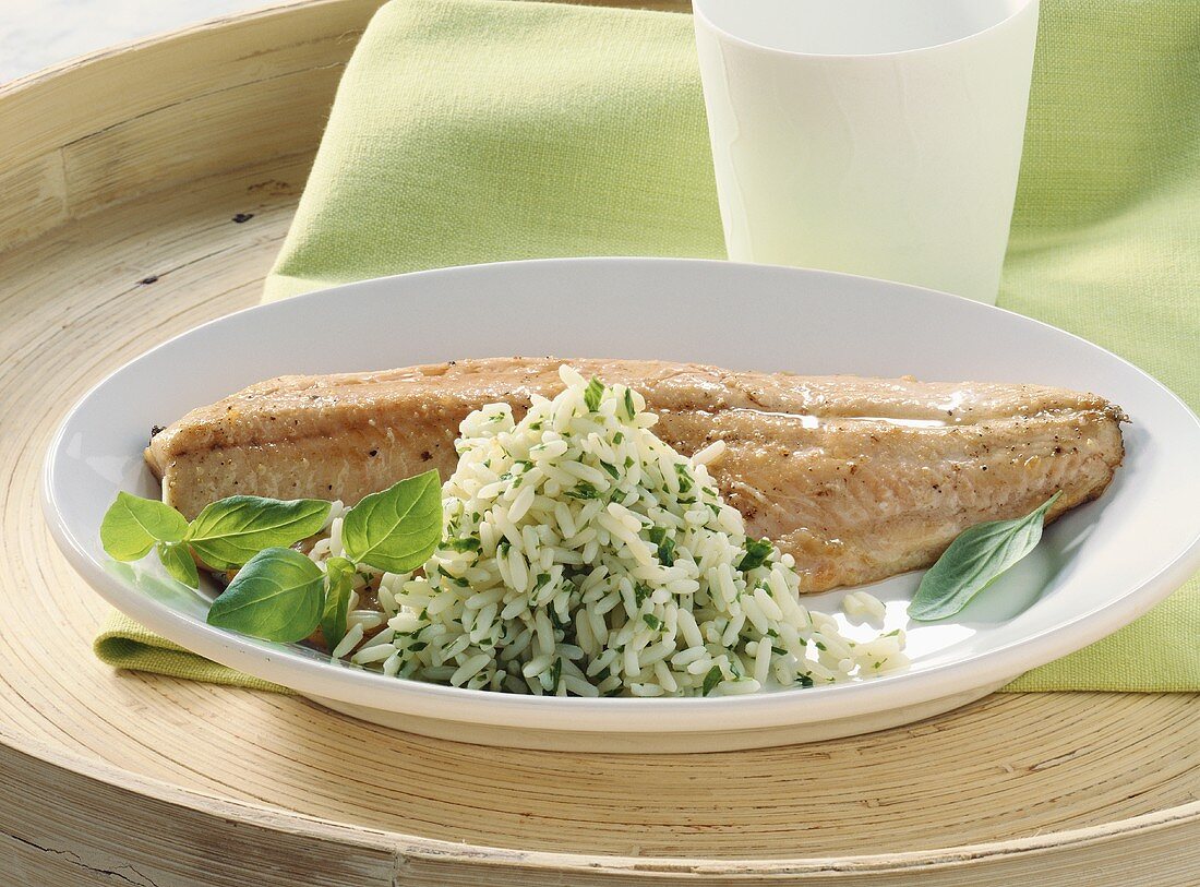 Fried brook trout fillet with herb rice