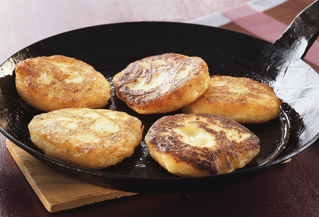 Potato cakes in frying pan