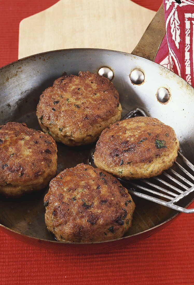 Burgers in frying pan